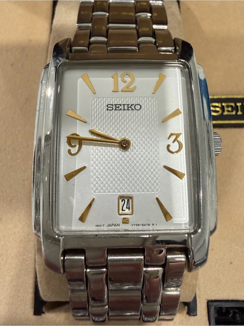 Seiko Silver Watch with Gold Accents and Rectangular Dial